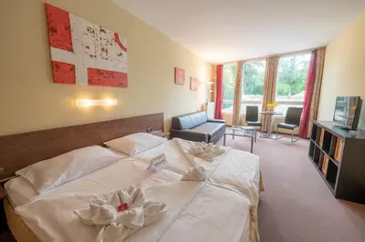 Ein Bett oder Betten in einem Zimmer der Unterkunft Parkhotel Eisenstadt