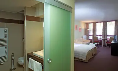 Ein Bett oder Betten in einem Zimmer der Unterkunft Parkhotel Eisenstadt