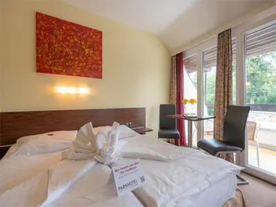 Ein Bett oder Betten in einem Zimmer der Unterkunft Parkhotel Eisenstadt
