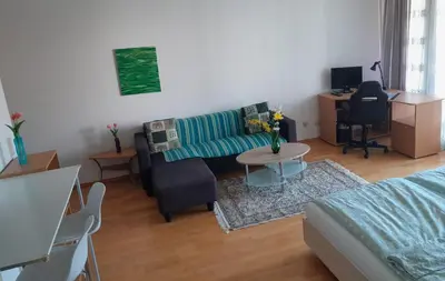 TV/Unterhaltungsangebot in der Unterkunft Serviced Apartment with Sunny Balcony