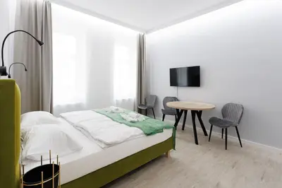 Ein Bett oder Betten in einem Zimmer der Unterkunft Apartment house in Vienna