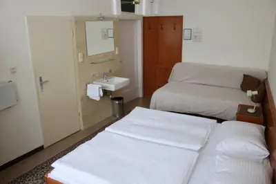 Ein Bett oder Betten in einem Zimmer der Unterkunft Pension Reimer