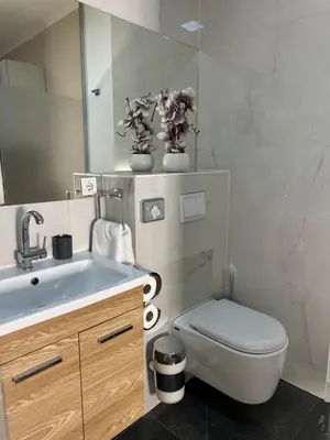 Ein Badezimmer in der Unterkunft 1st City Apartments