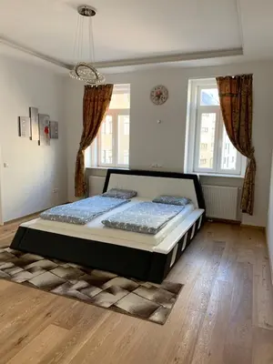 Ein Bett oder Betten in einem Zimmer der Unterkunft Colony Apartments