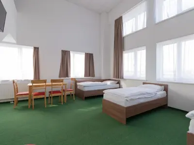 Ein Bett oder Betten in einem Zimmer der Unterkunft WinBudget 