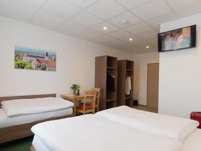 Ein Bett oder Betten in einem Zimmer der Unterkunft WinBudget 