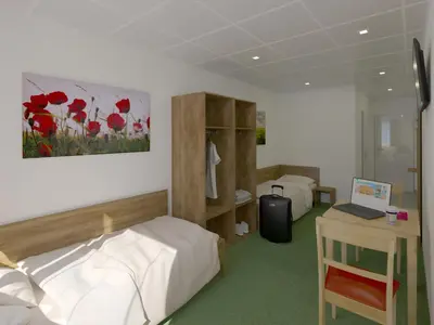 Ein Bett oder Betten in einem Zimmer der Unterkunft WinBudget 