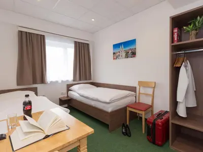 Ein Bett oder Betten in einem Zimmer der Unterkunft WinBudget 