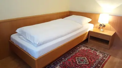 Ein Bett oder Betten in einem Zimmer der Unterkunft Pension Elfy