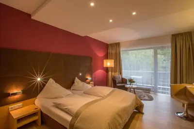Ein Bett oder Betten in einem Zimmer der Unterkunft Hotel Krainerhütte