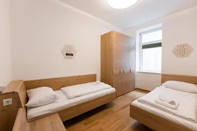 Ein Bett oder Betten in einem Zimmer der Unterkunft Nadland Apartment Wehlistrasse