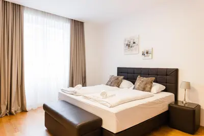Ein Bett oder Betten in einem Zimmer der Unterkunft Nadland Apartment Wehlistrasse