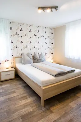 Ein Bett oder Betten in einem Zimmer der Unterkunft Apartment Fuchs-2 by Interhome