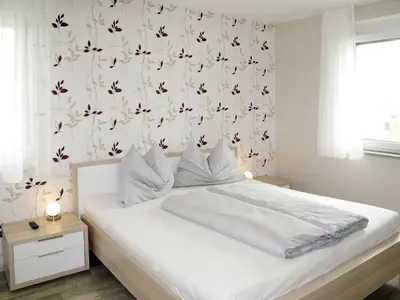 Ein Bett oder Betten in einem Zimmer der Unterkunft Apartment Fuchs-2 by Interhome
