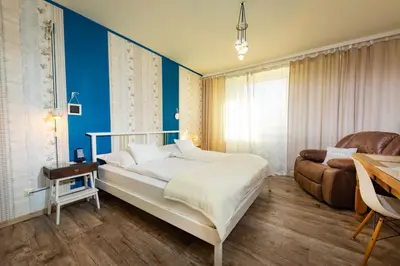 Ein Bett oder Betten in einem Zimmer der Unterkunft Hotel Freizeittempel