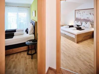 Ein Bett oder Betten in einem Zimmer der Unterkunft Weingut Gästehaus D&D Haider
