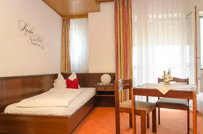 Ein Bett oder Betten in einem Zimmer der Unterkunft Gästehaus Schmidt