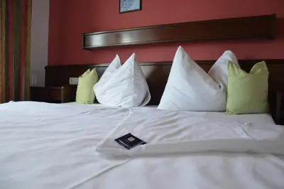 Ein Bett oder Betten in einem Zimmer der Unterkunft Gästehaus Schmidt