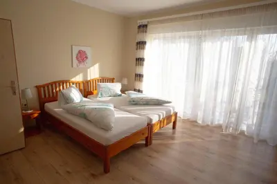 Ein Bett oder Betten in einem Zimmer der Unterkunft Gästehaus Mariola