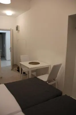 Ein Bett oder Betten in einem Zimmer der Unterkunft Hauptbahnhof