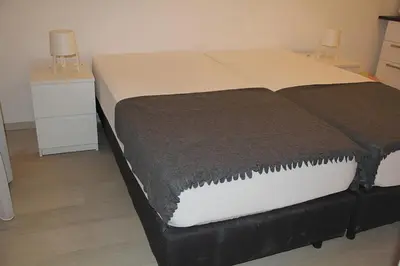 Ein Bett oder Betten in einem Zimmer der Unterkunft Hauptbahnhof