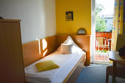 Ein Bett oder Betten in einem Zimmer der Unterkunft Die Pension Reeh