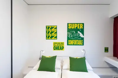 Ein Bett oder Betten in einem Zimmer der Unterkunft SLEEEP Hotel Wiener Neudorf
