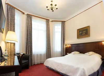Ein Bett oder Betten in einem Zimmer der Unterkunft Hotel Viktoria Schönbrunn