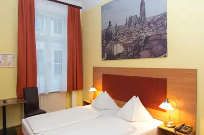 Ein Bett oder Betten in einem Zimmer der Unterkunft Pension Lehrerhaus