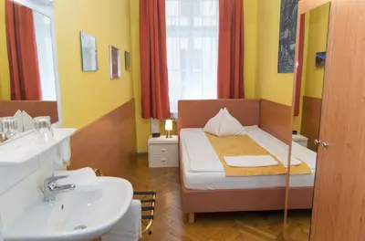 Ein Bett oder Betten in einem Zimmer der Unterkunft Pension Lehrerhaus