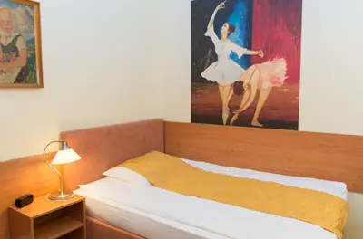 Ein Bett oder Betten in einem Zimmer der Unterkunft Pension Lehrerhaus