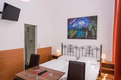Ein Bett oder Betten in einem Zimmer der Unterkunft Pension Lehrerhaus