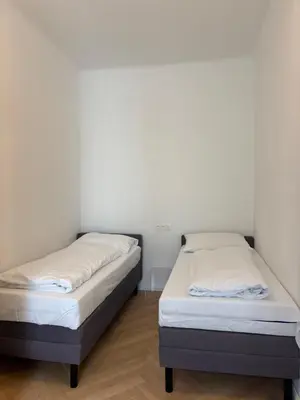 Ein Bett oder Betten in einem Zimmer der Unterkunft Carlton Suites
