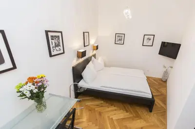 Ein Bett oder Betten in einem Zimmer der Unterkunft Carlton Suites