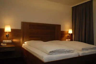 Ein Bett oder Betten in einem Zimmer der Unterkunft Pension am Kurpark