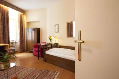 Ein Bett oder Betten in einem Zimmer der Unterkunft Mondial Appartement Hotel