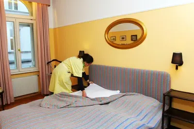 Ein Bett oder Betten in einem Zimmer der Unterkunft Mondial Appartement Hotel