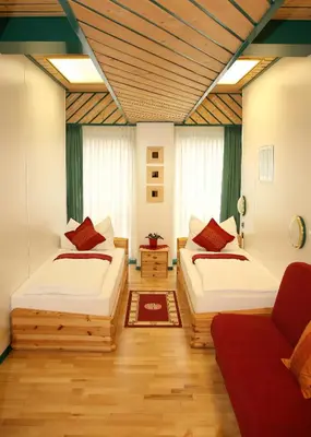 Ein Bett oder Betten in einem Zimmer der Unterkunft Hotel Asperner Löwe