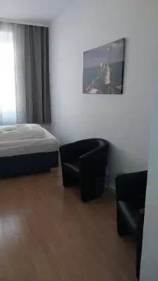 Ein Bett oder Betten in einem Zimmer der Unterkunft Aparthotel LAAERBERG