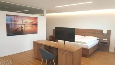 Ein Bett oder Betten in einem Zimmer der Unterkunft Seesuiten Mörbisch
