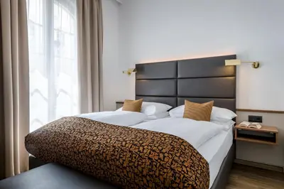Ein Bett oder Betten in einem Zimmer der Unterkunft IMLAUER Hotel Nestroy Wien