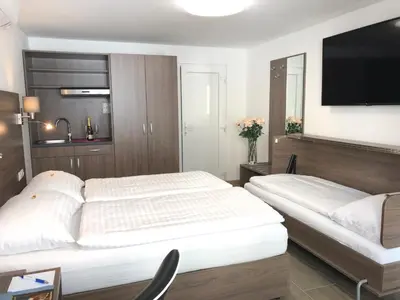 Ein Bett oder Betten in einem Zimmer der Unterkunft Hotel König