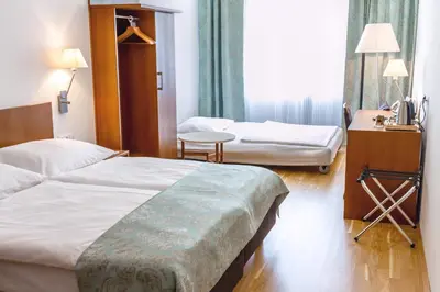 Ein Bett oder Betten in einem Zimmer der Unterkunft Benediktushaus im Schottenstift