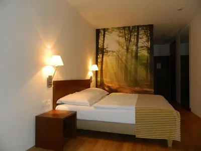 Ein Bett oder Betten in einem Zimmer der Unterkunft Benediktushaus im Schottenstift