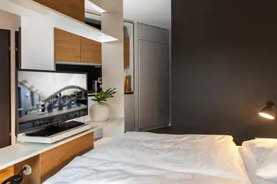 Ein Bett oder Betten in einem Zimmer der Unterkunft smartments Wien Hauptbahnhof - Serviced Apartments