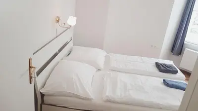 Ein Bett oder Betten in einem Zimmer der Unterkunft Sobieski District-1 Ring Apartments