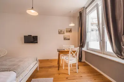 Ein Bett oder Betten in einem Zimmer der Unterkunft La Perla Vintage-Apartments