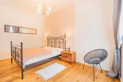Ein Bett oder Betten in einem Zimmer der Unterkunft La Perla Vintage-Apartments