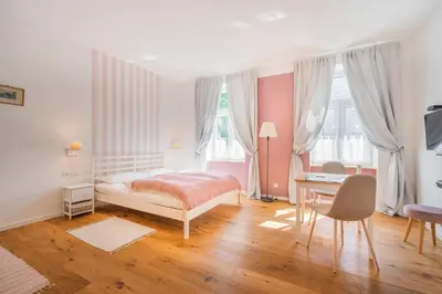 Ein Bett oder Betten in einem Zimmer der Unterkunft La Perla Vintage-Apartments