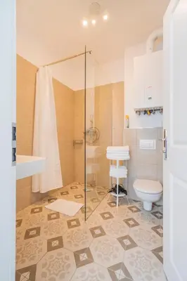 Ein Badezimmer in der Unterkunft La Perla Vintage-Apartments